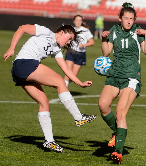 Trent Nelson  |  The Salt Lake Tribune
Waterford's KitKat Morrill (33) kicks the ball into Rowland Hall's Meg Janes Def (11) as Rowland Hall defeats Waterford in the 2A girls' high school soccer state championship game at Rio Tinto Stadium in Sandy, Saturday October 25, 2014.