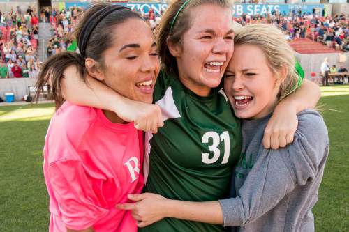 Trent Nelson  |  The Salt Lake Tribune
Rowland Hall's Alyssa Cole (21), Katherine Veghte (31) and Elle Sweetland (8) celebrate their win over Waterford in the 2A girls' high school soccer state championship game at Rio Tinto Stadium in Sandy, Saturday October 25, 2014.