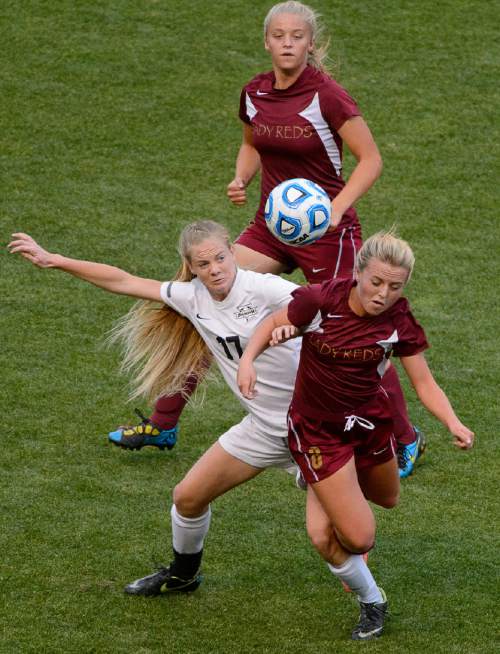 Trent Nelson  |  The Salt Lake Tribune
Desert Hills' Madelyn Hansen, center left, defended by Cedar City's Jade Zerkle, top, and Whitney Yardley, as Cedar City defeats Desert Hills in the 3A girls' high school soccer state championship game at Rio Tinto Stadium in Sandy, Saturday October 25, 2014.