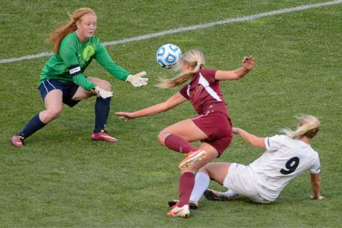 Trent Nelson  |  The Salt Lake Tribune
Cedar City goalkeeper Shay Bauman reaches for a save as Desert Hills' Brittany Terry (9) shoots Cedar City defeats Desert Hills in the 3A girls' high school soccer state championship game at Rio Tinto Stadium in Sandy, Saturday October 25, 2014.