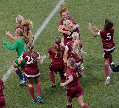 Trent Nelson  |  The Salt Lake Tribune
Cedar City players celebrate after beating Desert Hills in the 3A girls' high school soccer state championship game at Rio Tinto Stadium in Sandy, Saturday October 25, 2014.