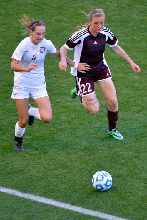 Chris Detrick  |  The Salt Lake Tribune
Davis' Riley Jacobs (5) and Lone Peak's Ellison Smith (22) go for the ball during the 5A girls' state soccer championship game at Rio Tinto Stadium Friday October 24, 2014.