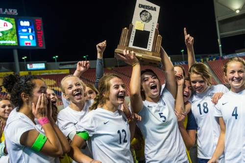 Chris Detrick  |  The Salt Lake Tribune
Members of the Timpanogos soccer team celebrate after winning during the 4A girls' state soccer championship game at Rio Tinto Stadium Friday October 24, 2014. Timpanogos defeated Skyline 7-6 in an overtime shootout.
