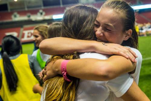 Chris Detrick  |  The Salt Lake Tribune
Timpanogos' Natalie Reynolds (5) hugs Aspyn Farrer (11) after winning during the 4A girls' state soccer championship game at Rio Tinto Stadium Friday October 24, 2014. Timpanogos defeated Skyline 7-6 in an overtime shootout.