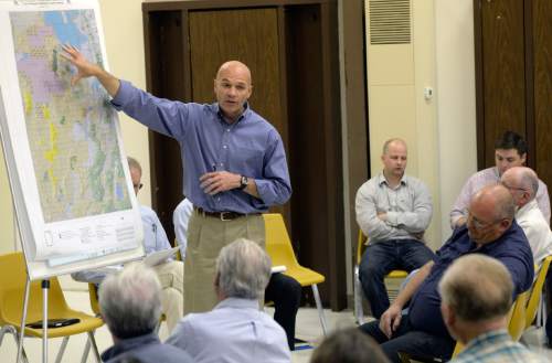 Al Hartmann  |  The Salt Lake Tribune
Lt. Col. Chris Robinson a U.S. Air Force representative discusses map of expansion of the Utah Test and Training Range during a presentation at a public forum Monday October 20 at West Desert High School in Partoun.
