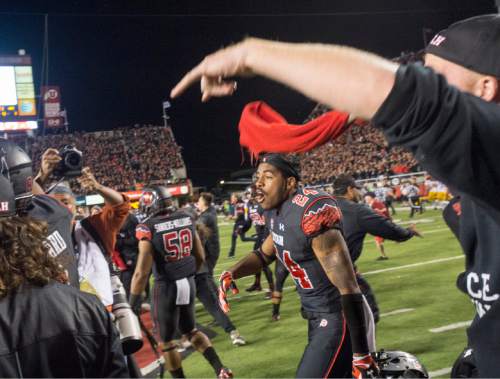 Rick Egan  |  The Salt Lake Tribune
 
The Utes storm the field to celebrate their 24-21 victory over the USC Trojans at Rice-Eccles Stadium, Saturday, October 25, 2014.
