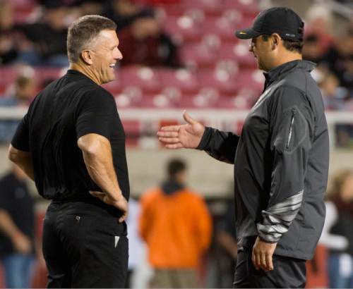 Rick Egan  |  The Salt Lake Tribune

Utah head coach Kyle Whittingham chats with USC Trojans head coach Steve Sarkisian before the Utes faced the Trojans in Pac-12 action at Rice-Eccles Stadium, Saturday, October 25, 2014