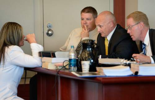 Scott Sommerdorf  |  The Salt Lake Tribune
Former WVC police officer Shain Cowley, center, looks on as attorneys Lindsay Jarvis, left, confers with investigator Bruce Champagne, and Paul Cassell, right, during the afternoon session of day three of Cowley's preliminary hearing, Wednesday, October 8, 2014. Cowley is charged with second-degree felony manslaughter for Nov. 2, 2012, fatal shooting of 21-year-old Danielle Willard.
