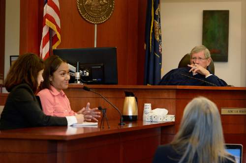 Scott Sommerdorf  |  The Salt Lake Tribune
Judge L.A. Dever looks on as Rosario Guillermo provides her eyewitness testimony through an interpreter, left, during day thee of former West Valley City police officer Shaun Cowley's preliminary hearing, Wednesday, October 8, 2014. Cowley is charged with second-degree felony manslaughter for Nov. 2, 2012, fatal shooting of 21-year-old Danielle Willard.