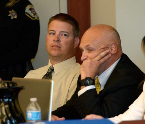 Scott Sommerdorf  |  The Salt Lake Tribune
Former West Valley City police officer Shaun Cowley, center, looks on as his lawyers confer during day three of Cowley's preliminary hearing, Wednesday, October 8, 2014. Cowley is charged with second-degree felony manslaughter for Nov. 2, 2012, fatal shooting of 21-year-old Danielle Willard.