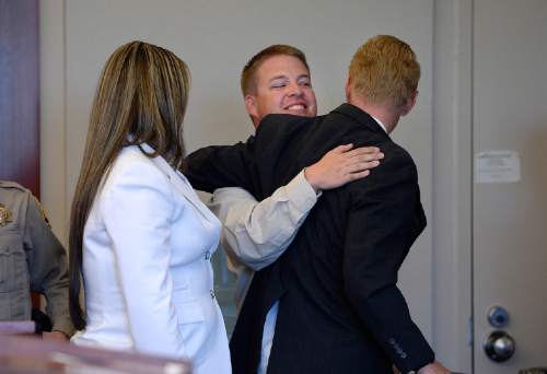 Scott Sommerdorf  |  The Salt Lake Tribune
Former West Valley City police officer Shaun Cowley hugs attorney Paul Cassell as he thanks his defense team at the end of Wednesday's hearing, Wednesday, October 8, 2014. Judge L.A. Dever said that he will rule tomorrow at 2pm. Cowley is charged with second-degree felony manslaughter for Nov. 2, 2012, fatal shooting of 21-year-old Danielle Willard.