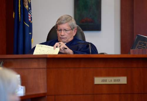 Scott Sommerdorf  |  The Salt Lake Tribune
Judge L.A. Dever reviews testimony as he listens to the prosecutions closing remarks during day three of Cowley's preliminary hearing, Wednesday, October 8, 2014. Cowley is charged with second-degree felony manslaughter for Nov. 2, 2012, fatal shooting of 21-year-old Danielle Willard.