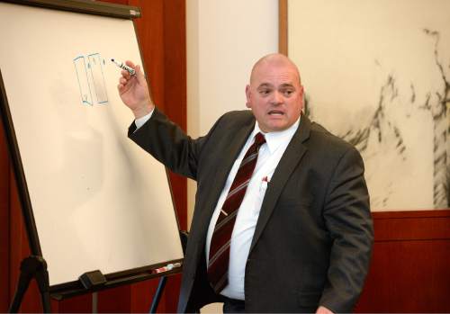 Scott Sommerdorf  |  The Salt Lake Tribune
WVC detective David Greco testifies while drawing a diagram of the relative positions of vehicles during day three of Cowley's preliminary hearing, Wednesday, October 8, 2014. Cowley is charged with second-degree felony manslaughter for Nov. 2, 2012, fatal shooting of 21-year-old Danielle Willard.
