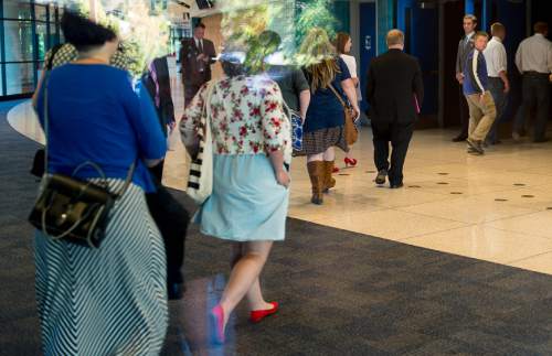 Trent Nelson  |  The Salt Lake Tribune
Women enter BYU's Marriott Center for a broadcast of the LDS General Priesthood Session in Provo Saturday October 4, 2014. The event was one of several planned by Ordain Women.