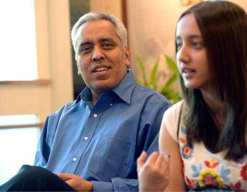 Al Hartmann  |  The Salt Lake Tribune
"Meet the Mormons" cast member Bishnu Adhikari, left, listens as her daughter Smina describes her experiences as a Mormon teenager in Nepal.  Bishnu received a degree in engineering and returned to his home in Nepal as a new Mormon.  He lives his new faith while respecting his culture and family expecatations.
