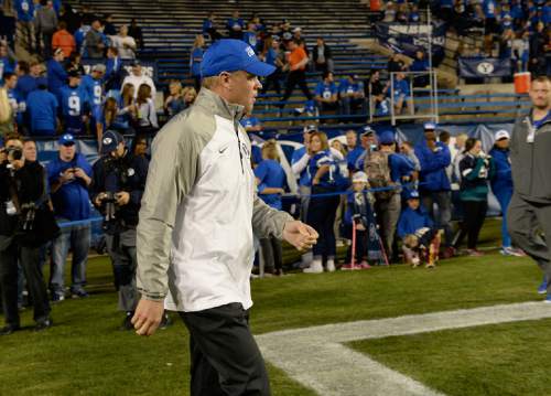 Scott Sommerdorf  |  Tribune file photo
BYU head coach Bronco Mendenhall walked onto the field during pre game warmups before BYU plays Utah State in Provo, Friday, October 1, 2014.