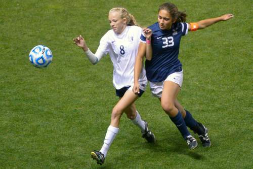 Chris Detrick  |  The Salt Lake Tribune
Timpanogos' Devri Hartle (8) and Skyline's Jaslyn Masina (33) go for the ball during the 4A girls' state soccer championship game at Rio Tinto Stadium Friday October 24, 2014.