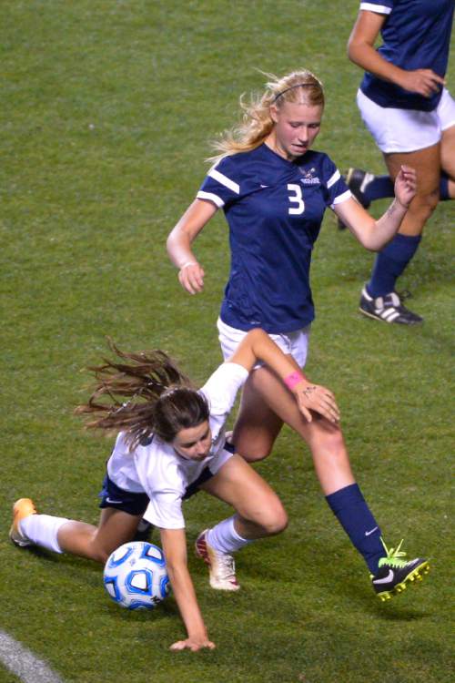 Chris Detrick  |  The Salt Lake Tribune
Timpanogos' Tess Donaldson (9) and Skyline's Madelyn Gill (3) go for the ball during the 4A girls' state soccer championship game at Rio Tinto Stadium Friday October 24, 2014.
