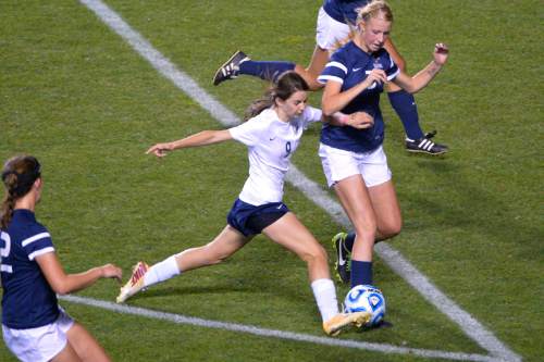 Chris Detrick  |  The Salt Lake Tribune
Timpanogos' Tess Donaldson (9) and Skyline's Madelyn Gill (3) go for the ball during the 4A girls' state soccer championship game at Rio Tinto Stadium Friday October 24, 2014.