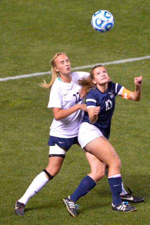 Chris Detrick  |  The Salt Lake Tribune
Timpanogos' Kaity Babb (22) and Skyline's Emma Heyn (10) go for the ball during the 4A girls' state soccer championship game at Rio Tinto Stadium Friday October 24, 2014.