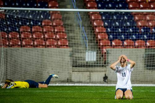 Chris Detrick  |  The Salt Lake Tribune
Timpanogos' Aspyn Farrer (11) celebrates after scoring the winning goal past Skyline's Hillary Weixler (1) during the 4A girls' state soccer championship game at Rio Tinto Stadium Friday October 24, 2014. Timpanogos defeated Skyline 7-6 in an overtime shootout.