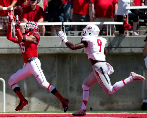 Jeremy Harmon  |  The Salt Lake Tribune

Utah's Dres Anderson (6) catches a pass for a touchdown while pursued by Fresno State's Curtis Riley (9) as the Utes host the Bulldogs at Rice-Eccles Stadium on Saturday, Sept. 6, 2014.