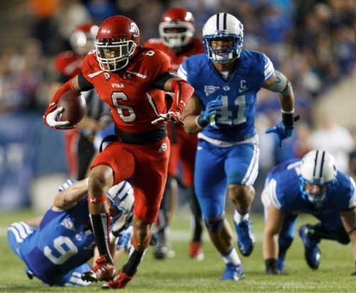 Trent Nelson  |  The Salt Lake Tribune
Utah Utes wide receiver Dres Anderson (6) runs out of the hands of Brigham Young Cougars defensive back Daniel Sorensen (9) in the second quarter as the BYU Cougars host the Utah Utes, college football Saturday, September 21, 2013 at LaVell Edwards Stadium in Provo.