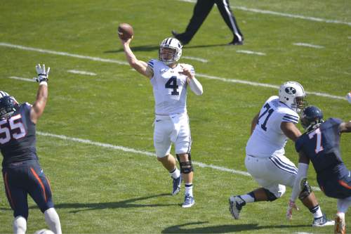 Chris Detrick  |  The Salt Lake Tribune
Brigham Young Cougars quarterback Taysom Hill (4) passe the ball during the game at LaVell Edwards Stadium Saturday September 20, 2014.  Virginia is winning the game 16-13 at halftime.