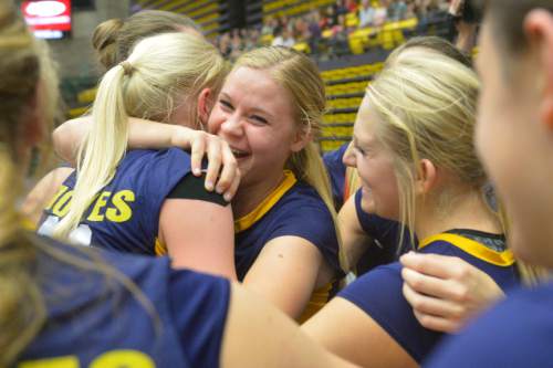 Chris Detrick  |  The Salt Lake Tribune
Members of the Enterprise volleyball team celebrate after winning the 2A state championship game at the UCCU Center at Utah Valley University Thursday October 30, 2014.