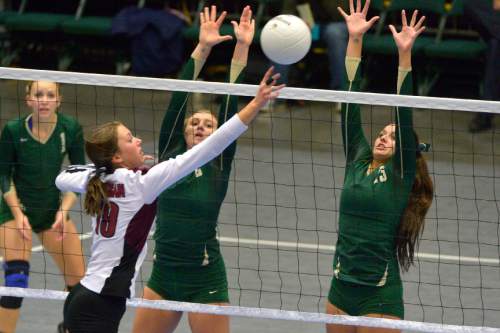 Chris Detrick  |  The Salt Lake Tribune
Morgan's Anna Cox (19) tries to hit the ball past Snow Canyon's Sydnie Hoskins (2) and Alexsa Parker (13) during the 3A state championship game at the UCCU Center at Utah Valley University Thursday October 30, 2014.