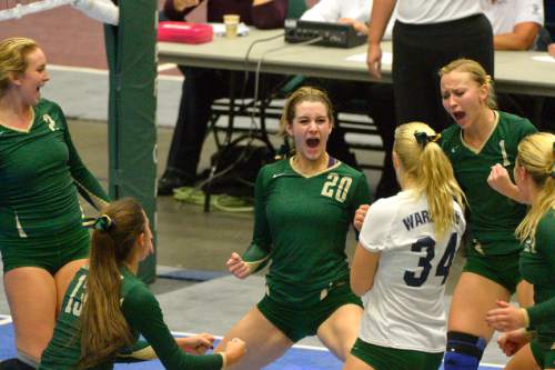 Chris Detrick  |  The Salt Lake Tribune
Snow Canyon's Katie Fisher (20) and her teammates celebrate after winning a point during the 3A state championship game at the UCCU Center at Utah Valley University Thursday October 30, 2014.