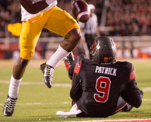 Rick Egan  |  The Salt Lake Tribune

Utah Utes wide receiver Tim Patrick (9) fumbles the ball near the end zone where it is recovered by the Trojans in Pac-12 action, Utah vs. USC, at Rice-Eccles Stadium, Saturday, October 25, 2014.