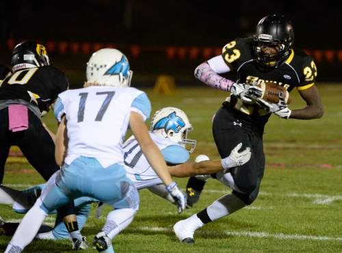 Francisco Kjolseth  |  The Salt Lake Tribune
Roy's Nate Jones, #23, tries to get past the Sky View defense in game action on Thursday, Oct. 23, 2014, at Roy High School.