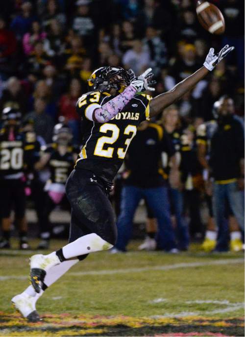 Francisco Kjolseth  |  The Salt Lake Tribune
Nate Jones, #23, of Roy comes up short for a long pass in game action against Roy on Thursday, Oct. 23, 2014, at Roy High School.