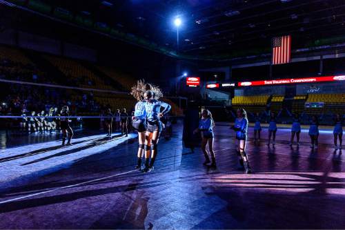 Trent Nelson  |  The Salt Lake Tribune
Piute players leap during player introductions as Panguitch faces Piute High School in the championship match of the State 1A Volleyball Tournament at Utah Valley University in Provo, Saturday November 1, 2014.