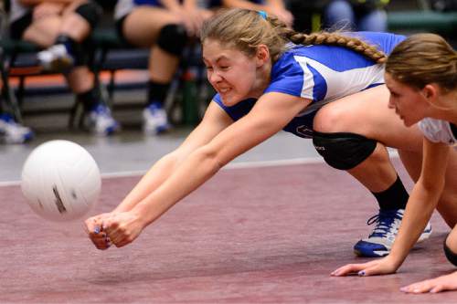 Trent Nelson  |  The Salt Lake Tribune
Panguitch's Darri Frandsen (10) dives for the ball as Panguitch defeats Piute High School in the championship match of the State 1A Volleyball Tournament at Utah Valley University in Provo, Saturday November 1, 2014.