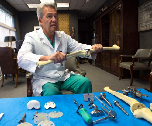 Steve Griffin  |  The Salt Lake Tribune


Orthopedic surgeon Lynn Rasmussen, of The Orthopedic Specialty Hospital in Murray, Utah, shows how an artificial knee joint functions in his office Wednesday, October 15, 2014. Rasmussen has developed a milling tool system, bottom, that accurately lines up the knee for joint replacement.