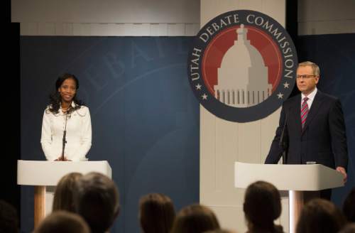 Steve Griffin  |  Tribune file photo


Mia Love and Doug Owens debate at the Dolores Doré Eccles Broadcast Center on the University of Utah campus in Salt Lake City, Tuesday, October 14, 2014. 
A Tribune/Hinckley poll shows that  Owens is ahead of  Love by six points. Political handicappers are calling 2016's race a tossup.