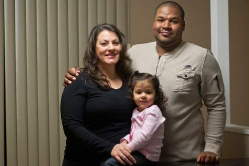 Chris Detrick  |  Tribune file photo
Jessica Szilagyi, William Bolden and Jazella Bolden, 2, pose for a portrait at their home in South Ogden on Feb. 5, 2013. Bolden, who had a son with an ex-girlfriend, challenged a requirement in the Utah Adoption Act that unwed fathers who want parental rights must file an affidavit pledging willingness to provide for their children.