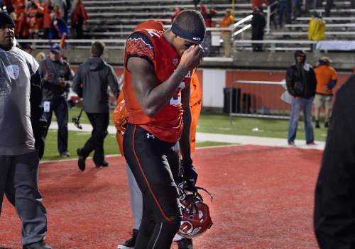 Scott Sommerdorf   |  The Salt Lake Tribune
A dejected WR Kenneth Scott leaves the field after Utah lost 28-27 to Washington State, Saturday, September 27, 2014.