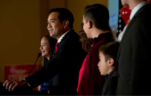 Steve Griffin  |  The Salt Lake Tribune

Surrounded by his family, Attorney General Sean Reyes delivers his victory speech during the GOP election night party at the Hilton in downtown Salt Lake City, Tuesday November 4, 2014.