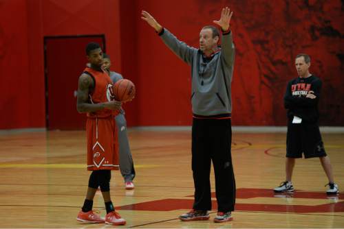 Francisco Kjolseth  |  The Salt Lake Tribune
University of Utah basketball coach Larry Krystkowiak runs his team through a workout recently. Utah's new motion offense should free up playmakers to take more initiative on the court.
