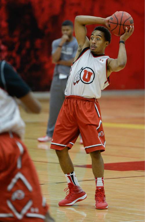 Francisco Kjolseth  |  The Salt Lake Tribune
Brandon Taylor looks for an opening as the Utah men's basketball team runs through drills recently. Utah's new motion offense should free up playmakers to take more initiative on the court.