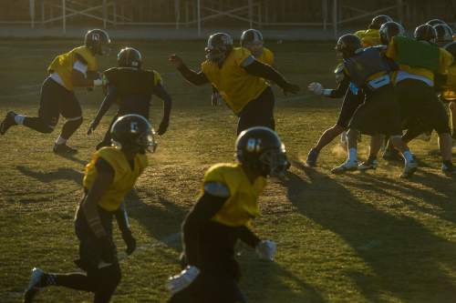 Chris Detrick  |  The Salt Lake Tribune
Members of the football team run drills during a practice at Summit Academy High School Wednesday November 5, 2014.