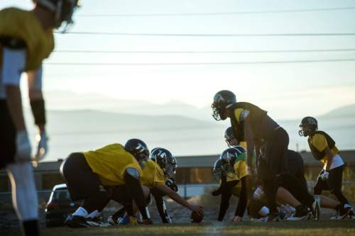 Chris Detrick  |  The Salt Lake Tribune
Members of the football team run drills during a practice at Summit Academy High School Wednesday November 5, 2014.