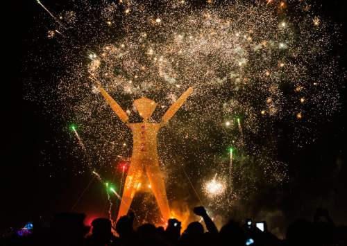 Rick Egan  |  The Salt Lake Tribune

The Burning Man is surrounded by fireworks, Saturday night, at the Burning Man festival, in the Black Rock Desert, north or Reno Nevada, August 30, 2014.