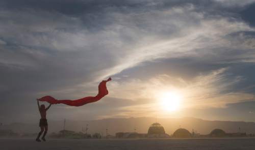 Rick Egan  |  The Salt Lake Tribune

Alexis Stricker, San Francisco, dances in the wind, at the Burning Man festival, in the Black Rock Desert, north or Reno Nevada, Thursday, August 28, 2014.