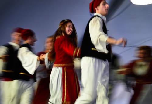 Scott Sommerdorf   |  The Salt Lake Tribune
The Parthenon Dancers perform a fast paced dance at the Greek Festival, Saturday, September 6, 2014.