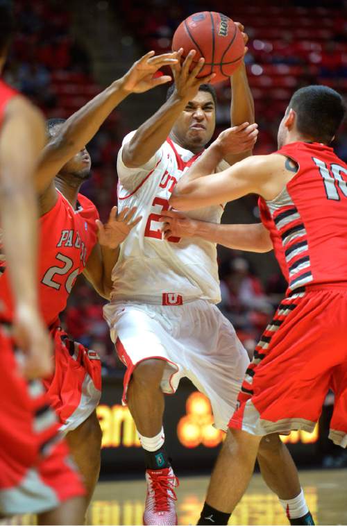 Chris Detrick  |  The Salt Lake Tribune
Utah Utes guard Kenneth Ogbe (25) runs through Pacific Boxers DeVon Pouncey (20) and Pacific Boxers Bobby Ahern (10) during the game at the Huntsman Center Thursday November 6, 2014.