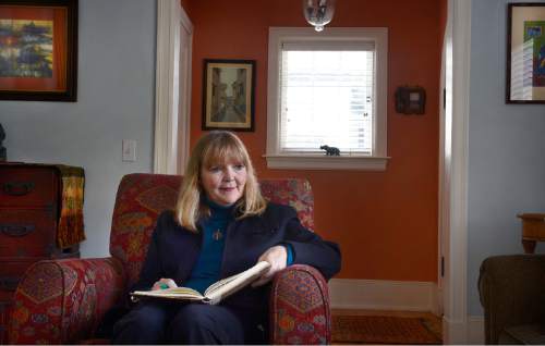 Scott Sommerdorf  |  The Salt Lake Tribune
The Rev. Patty Willis, pastor at South Valley Unitarian Universalist Church, reads in her living room in Salt Lake City home, Thursday, November 6, 2014.